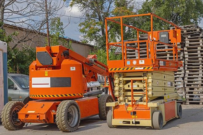 forklift in action at busy industrial warehouse in Carney